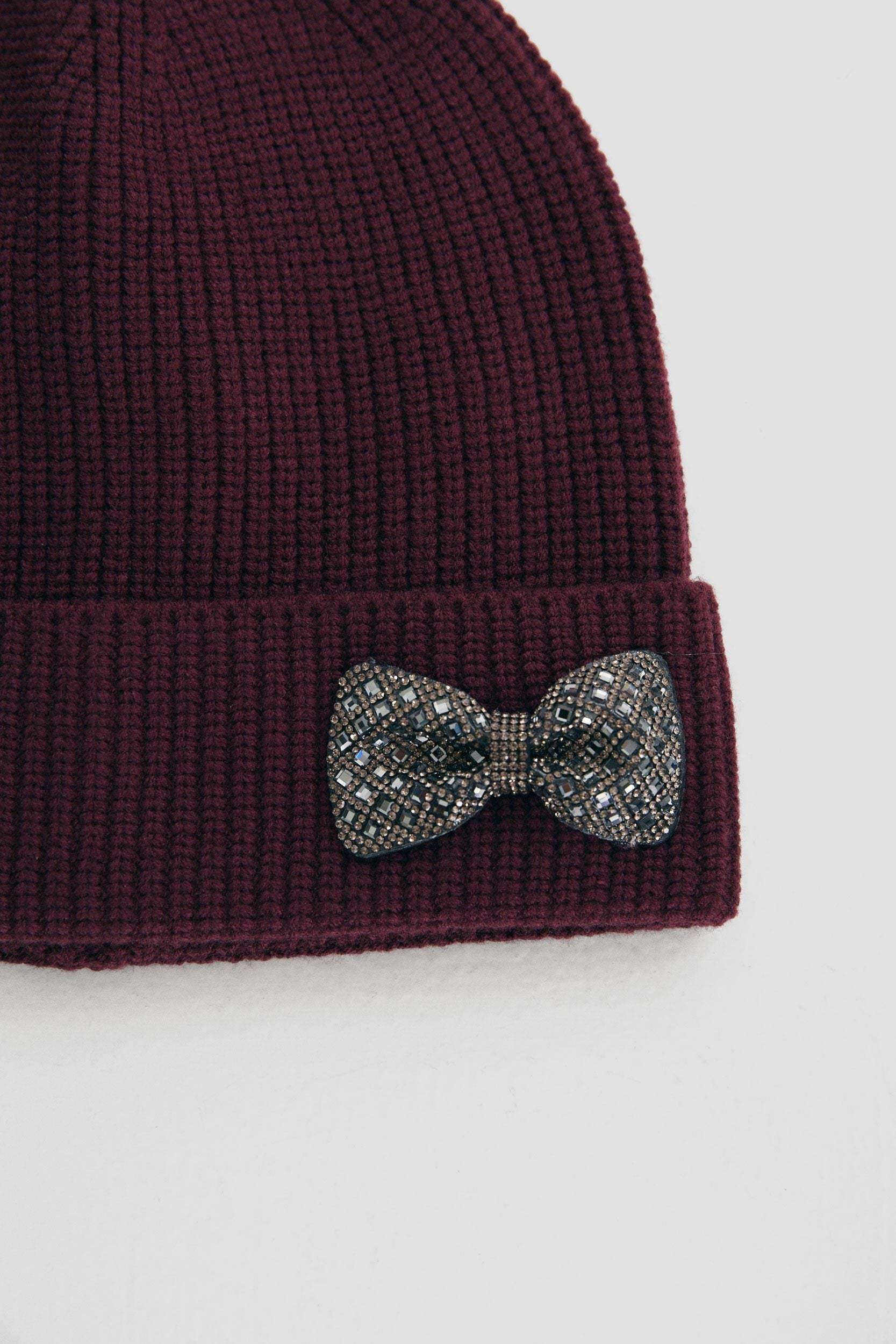 Beanie with decorative bow