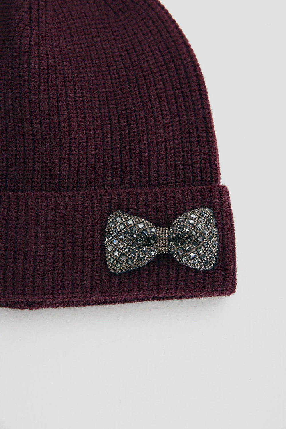 Beanie with decorative bow
