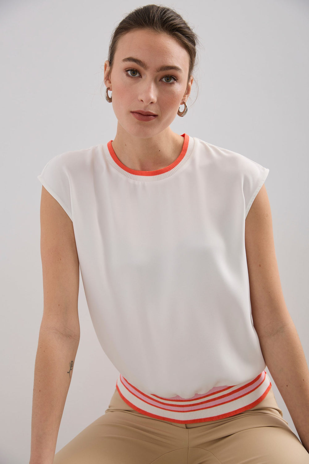 Sleeveless top with striped rib knit detail