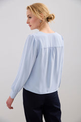 Long-sleeved blouse with a draped front