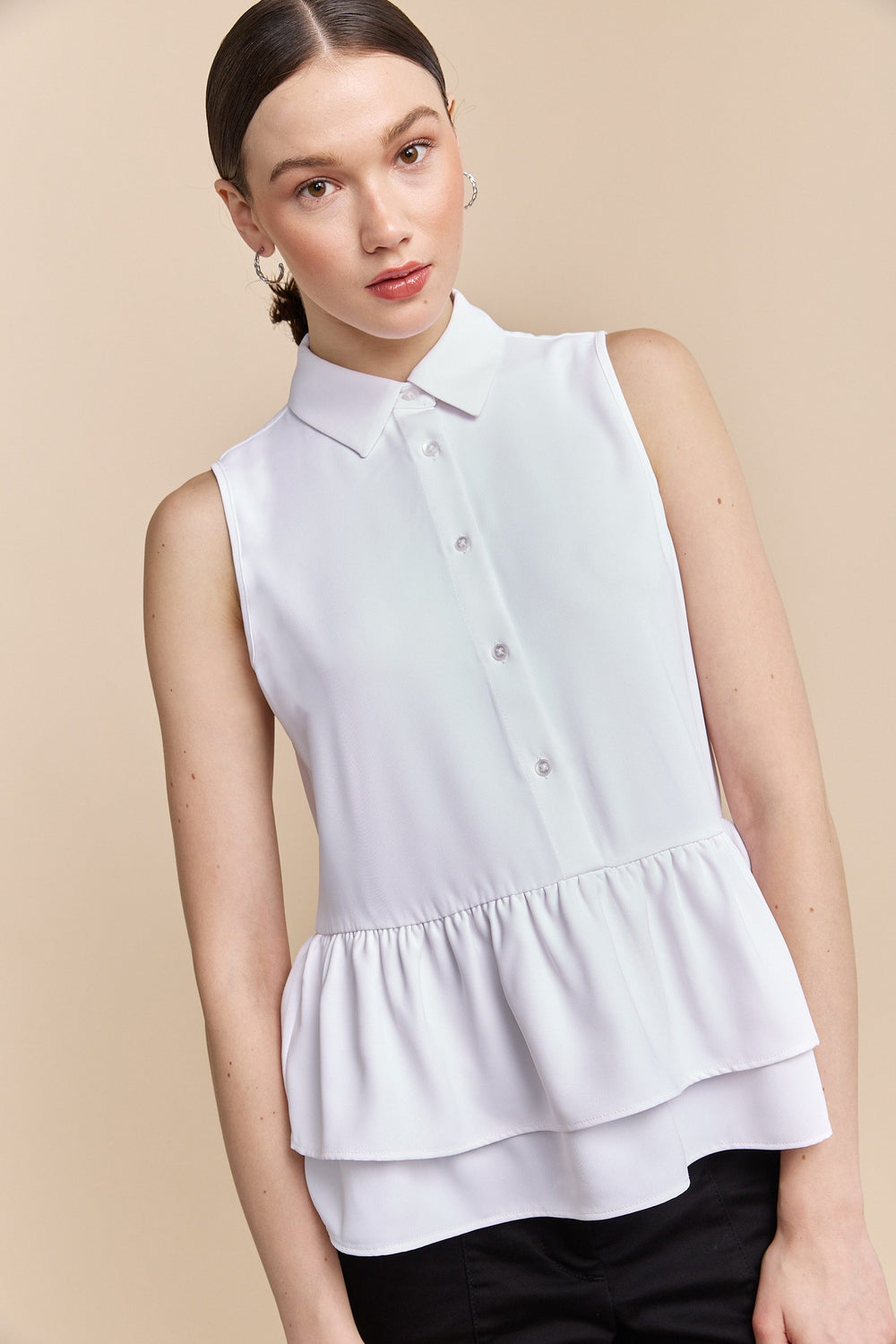 Sleeveless blouse with frills