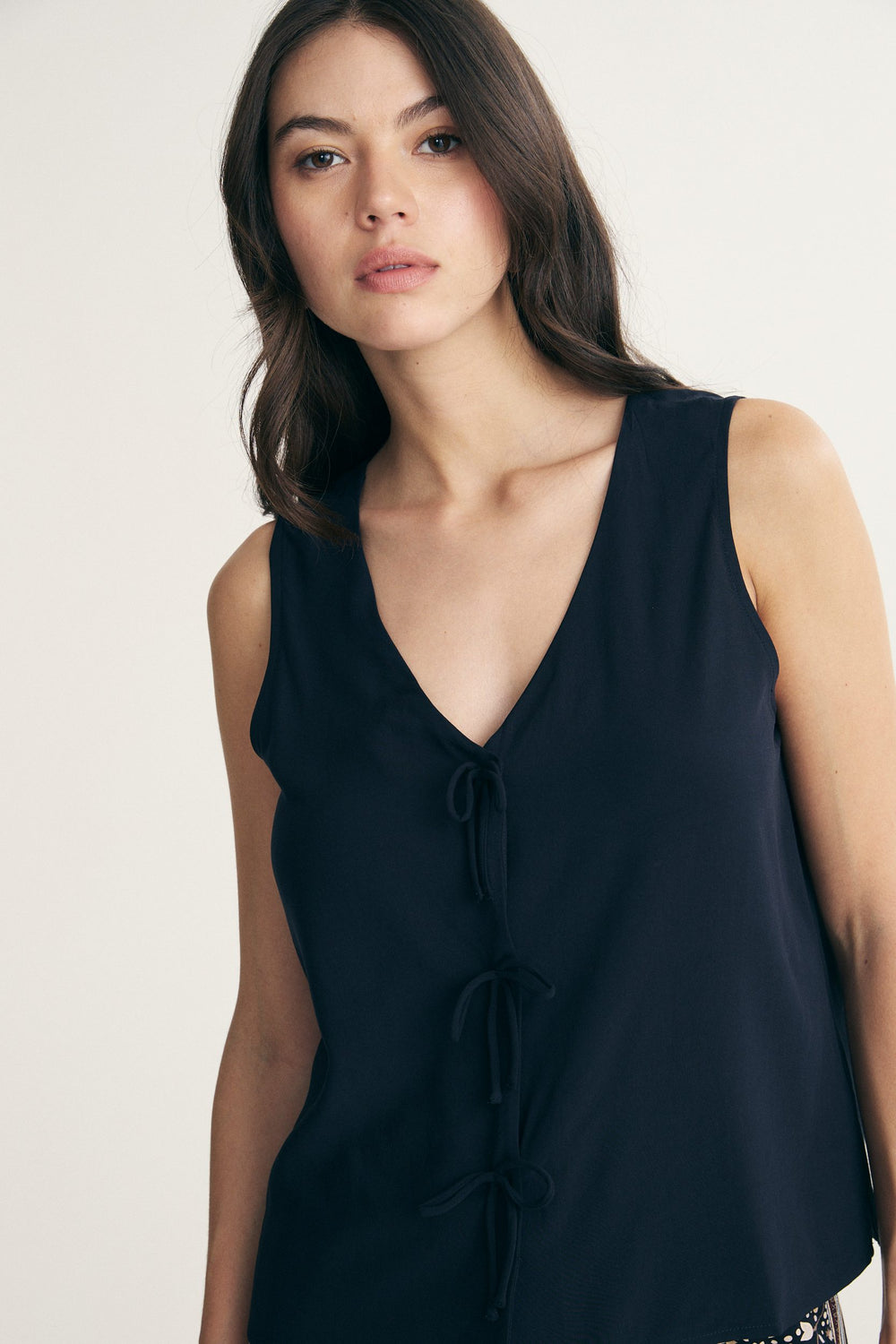 Sleeveless top with bows