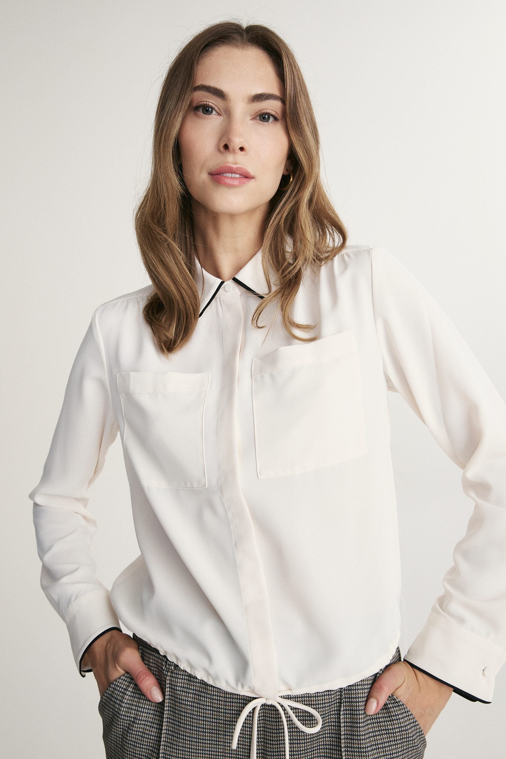 Fluid blouse with contrast detail