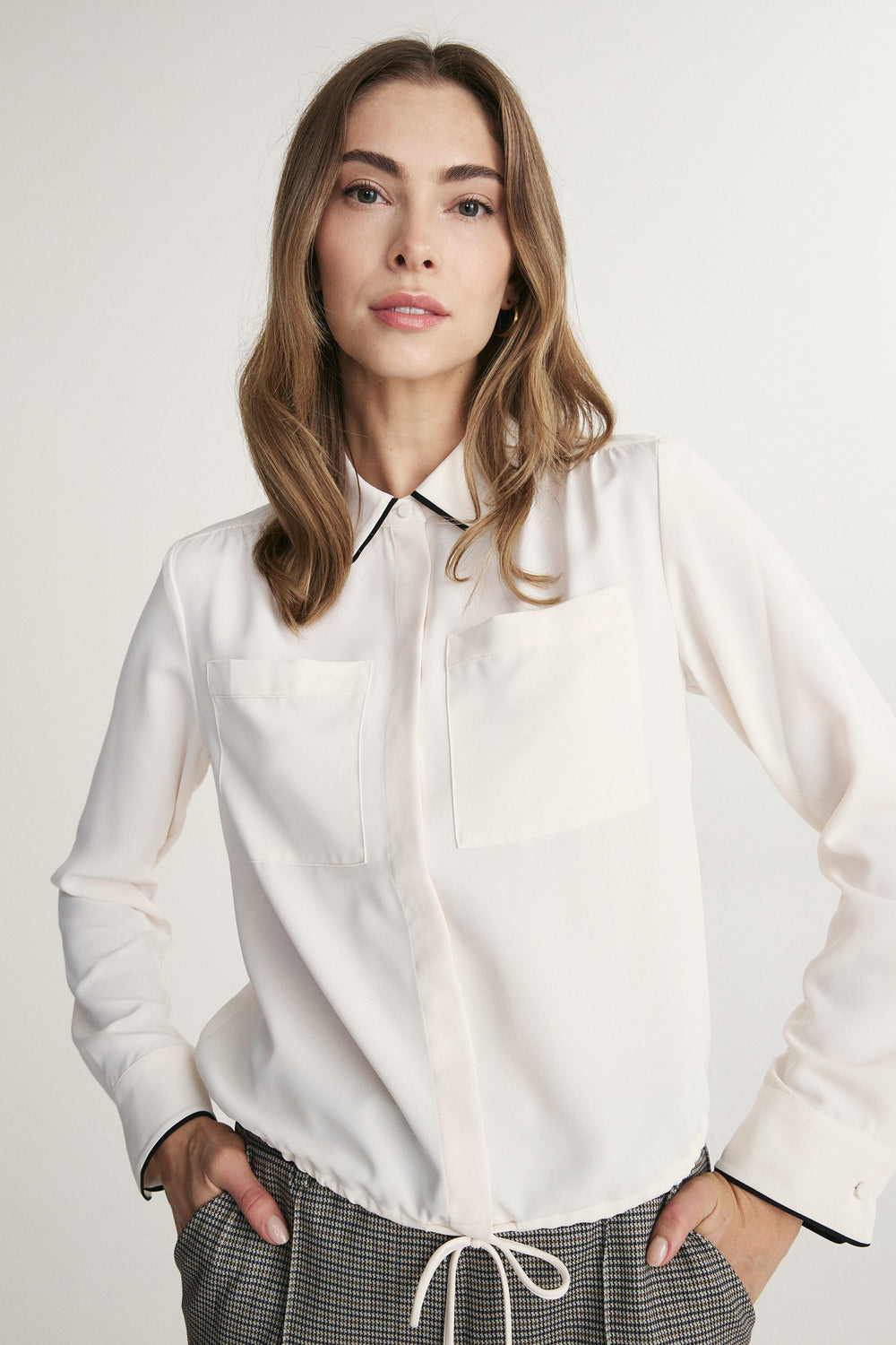 Fluid blouse with contrast detail