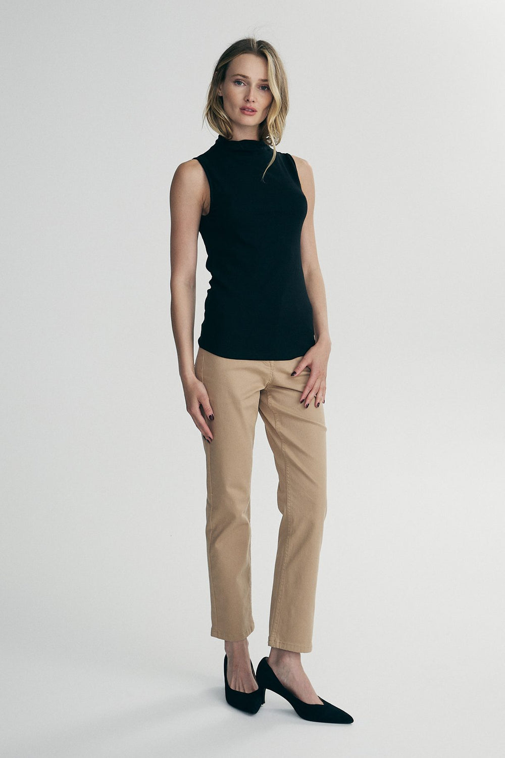 Sleeveless top with stand-up collar