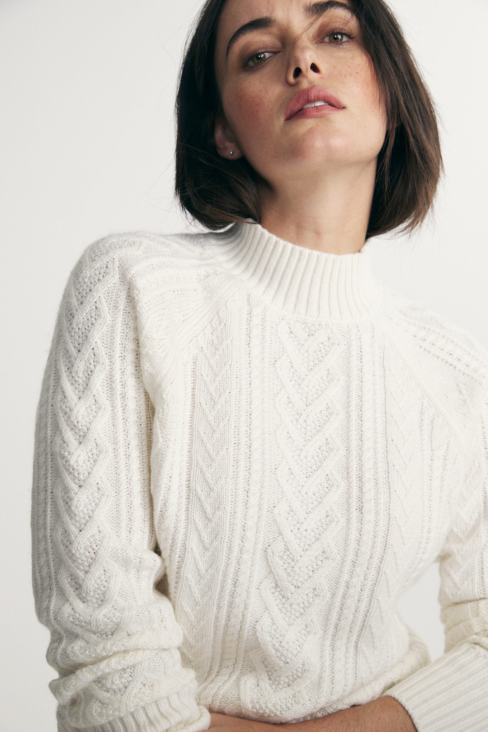 Mock neck cable knit sweater