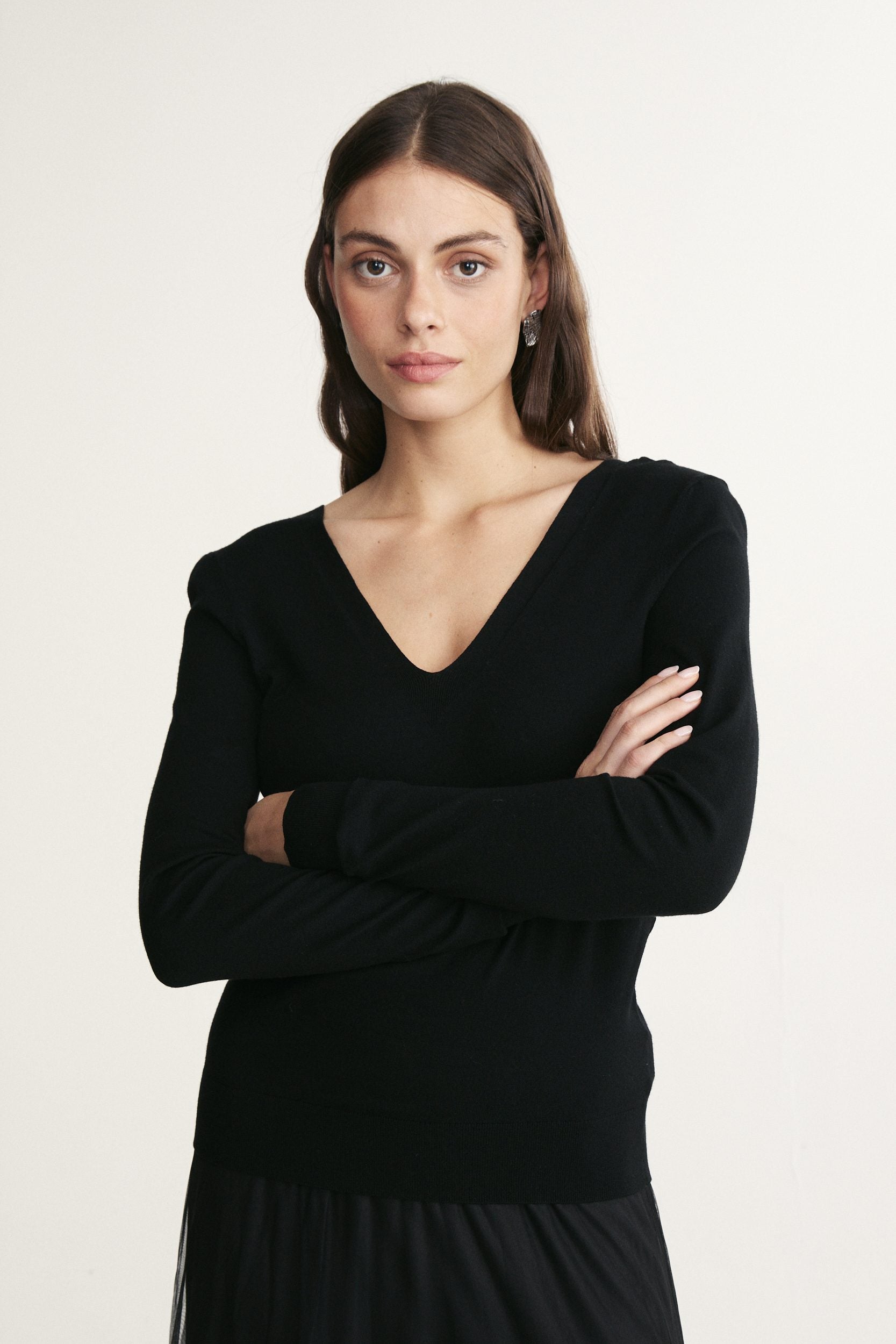 Pull à dos ouvert et col en V