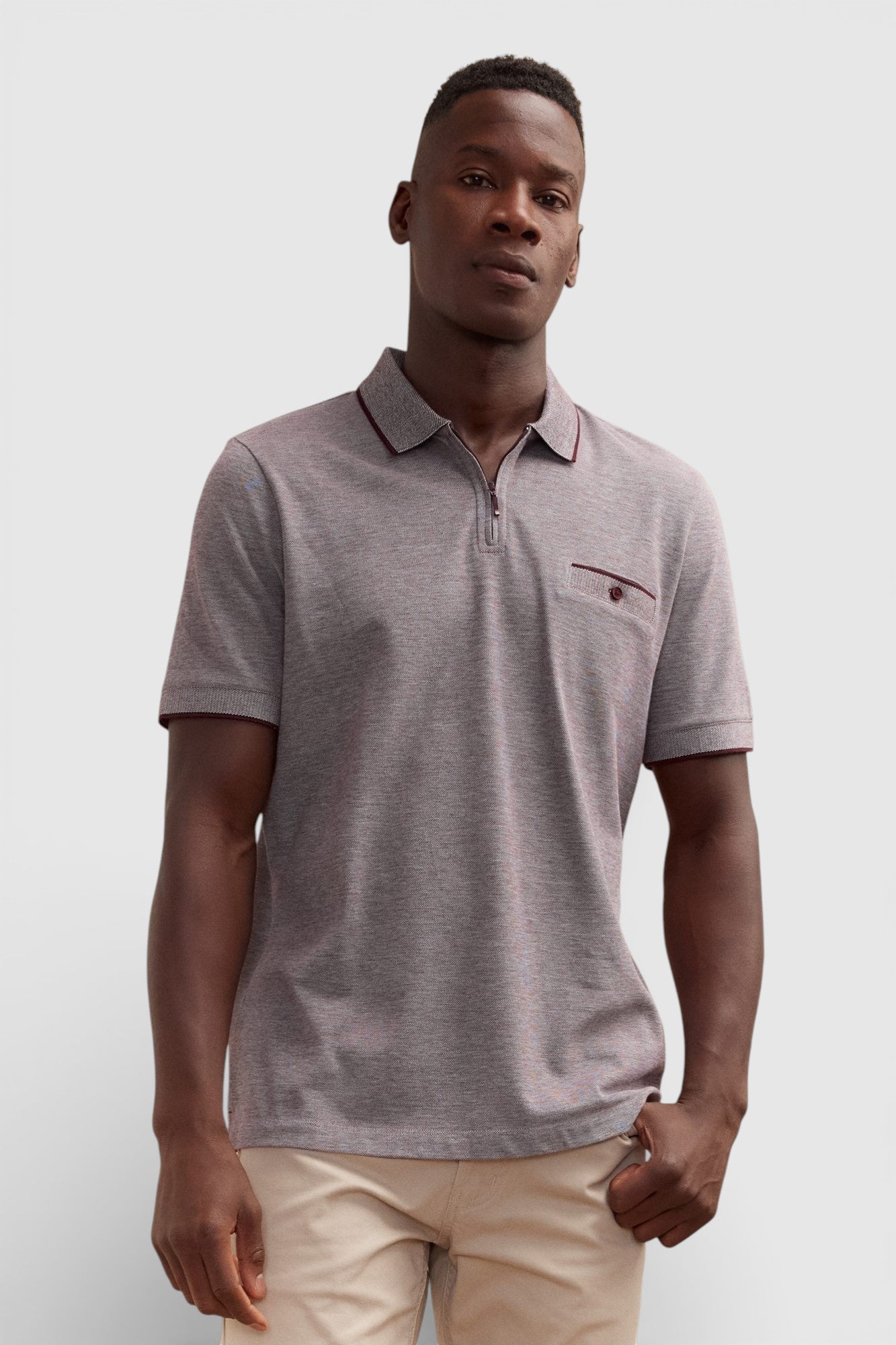 Polo texturé col zippé