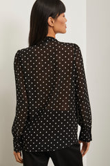 Chemisier à pois et manches bouffantes