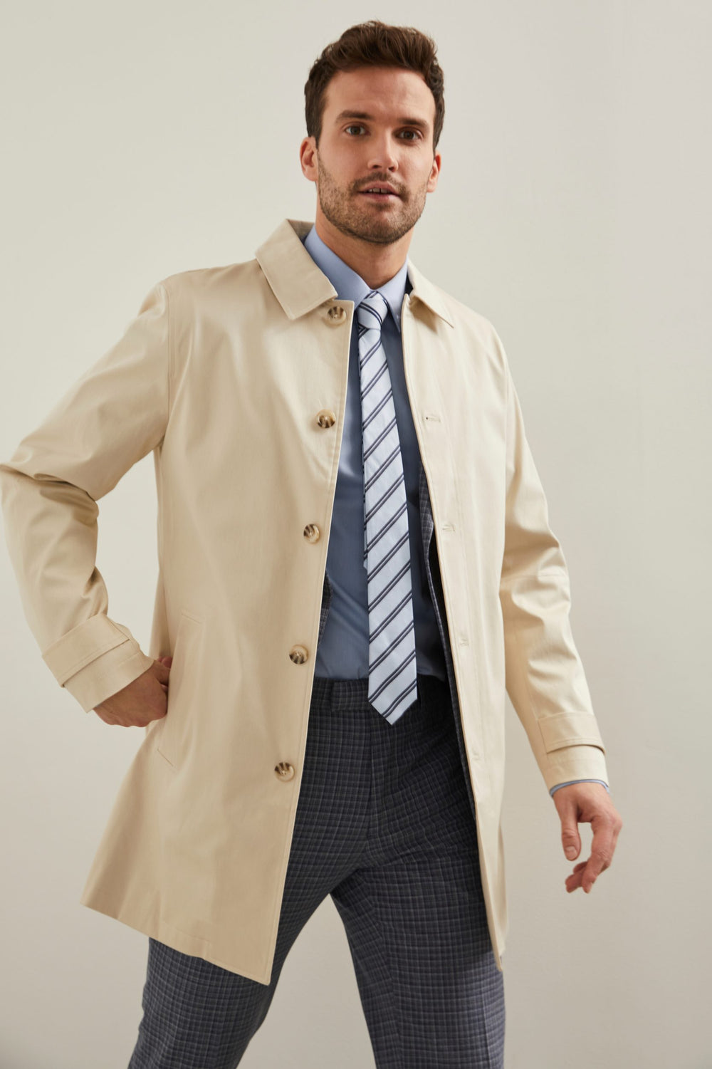 Imperméable boutonnière cachée